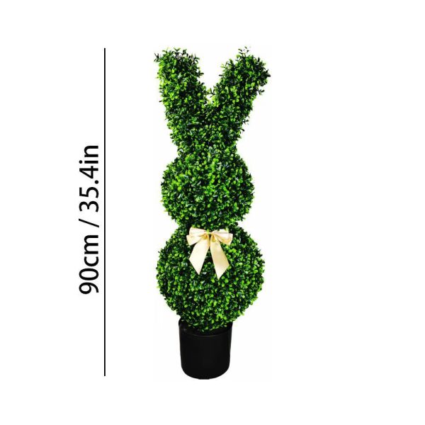Faux animal-shaped greenery for spring display