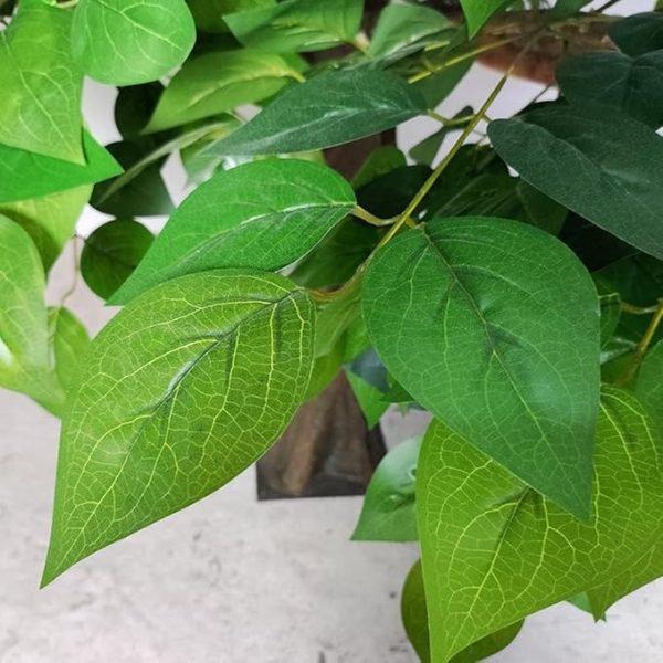Lifelike artificial apple tree with red fruits